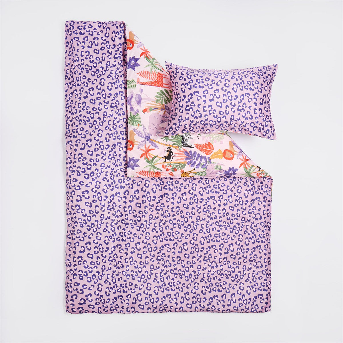 Detail of reversible purple animal spot pattern on safari double duvet cover