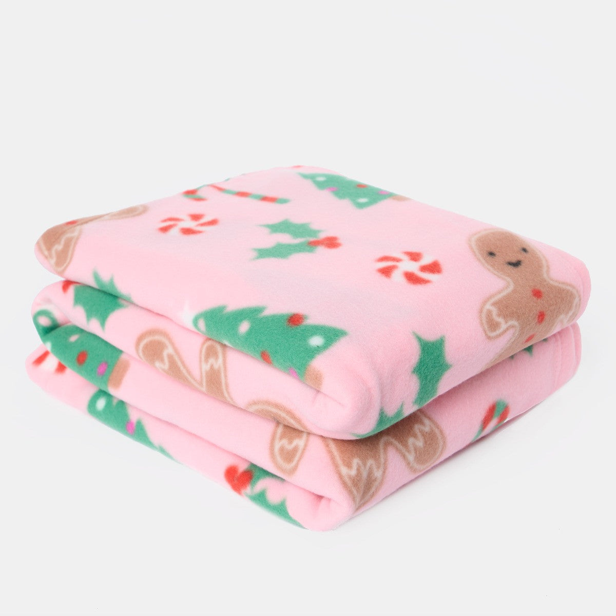 folded pink gingerbread fleece throw, showing the soft polyester fabric and gingerbread theme