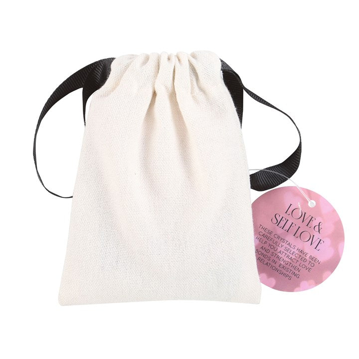 drawstring gift pouch with label containing love and self healing crystal set