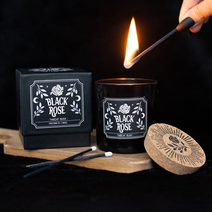 twilight blush scented candle being lit beside sliding gift box in home setting