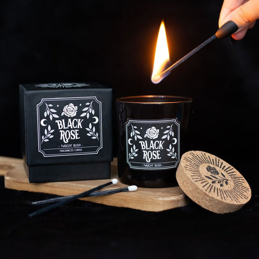 twilight blush scented candle being lit beside sliding gift box in home setting