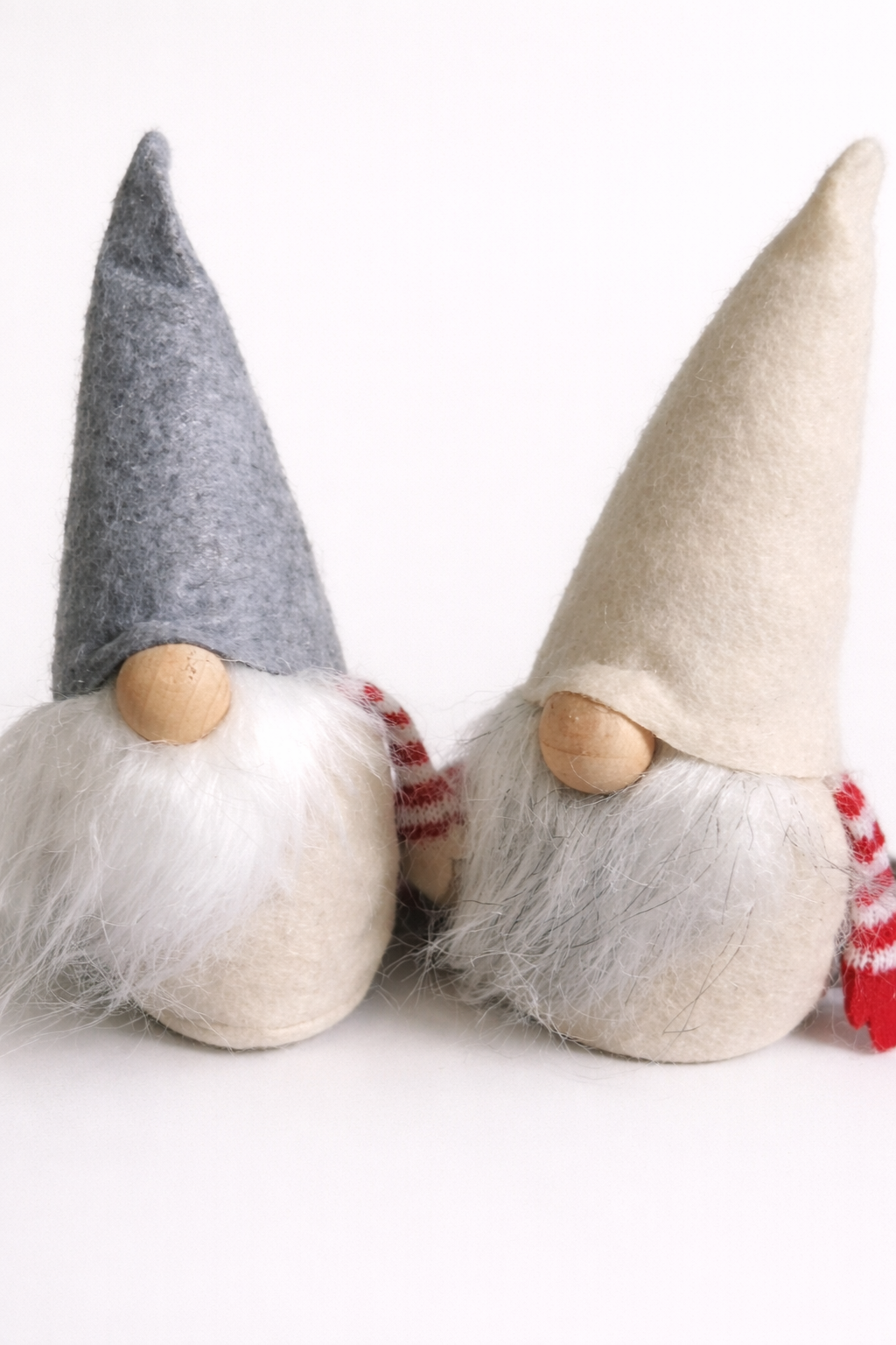 set of two christmas felt gonks with beards hats and weighted bases for festive decor
