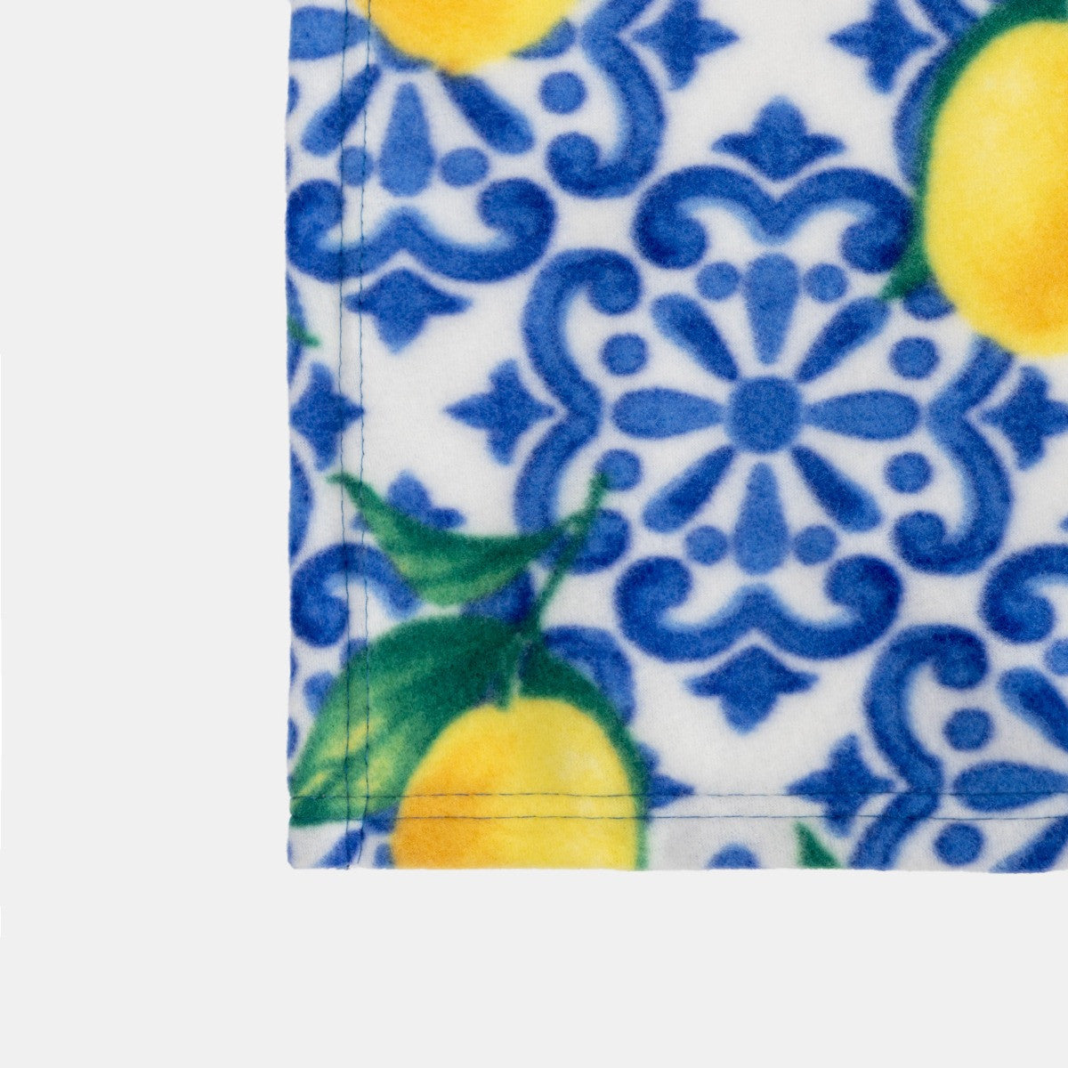 close up of fleece throw fabric showing lemon motif and soft finish