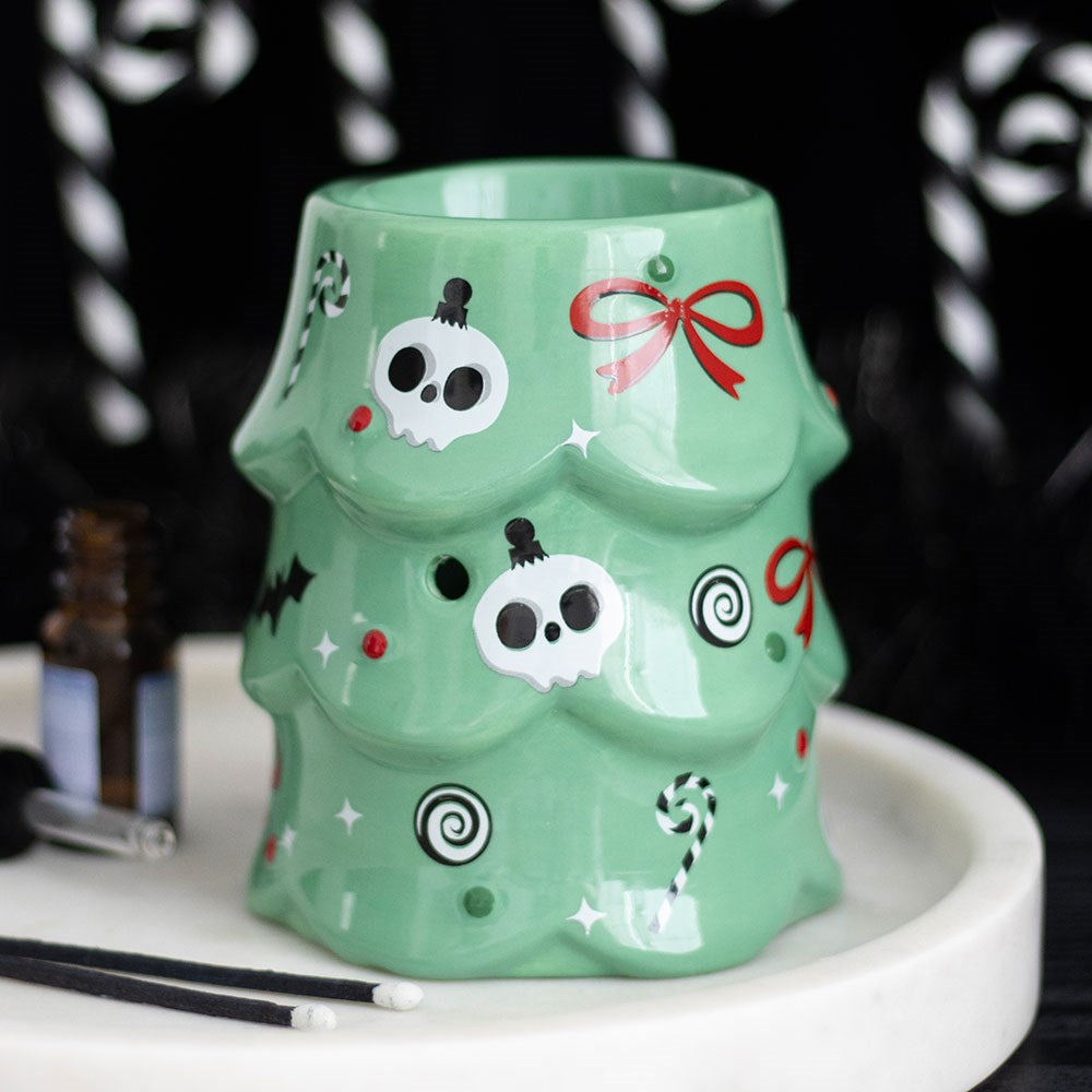 creepy christmas tree oil burner displayed on a festive tray