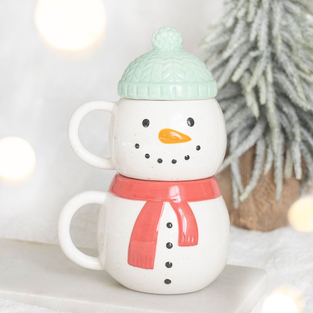 christmas snowman stacking mugs displayed together in a festive home setting