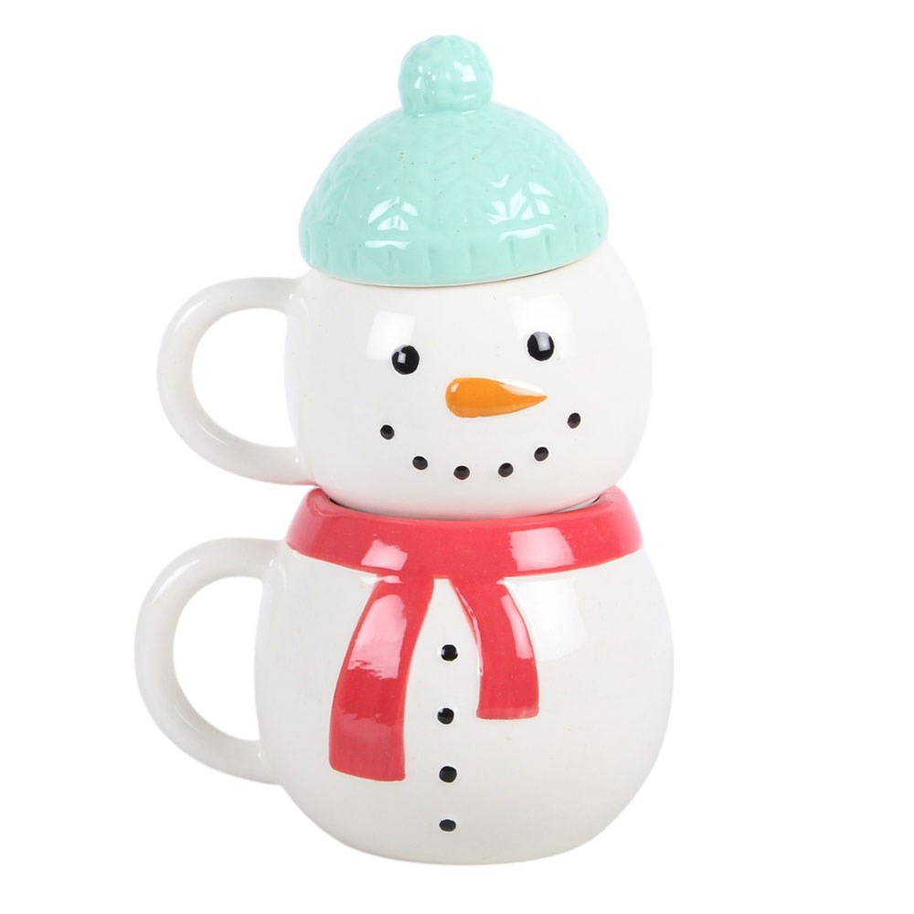 two christmas snowman ceramic mugs stacked together with coordinating designs