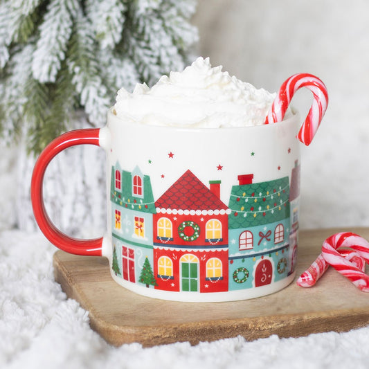 christmas street print ceramic mug displayed in a cosy home setting