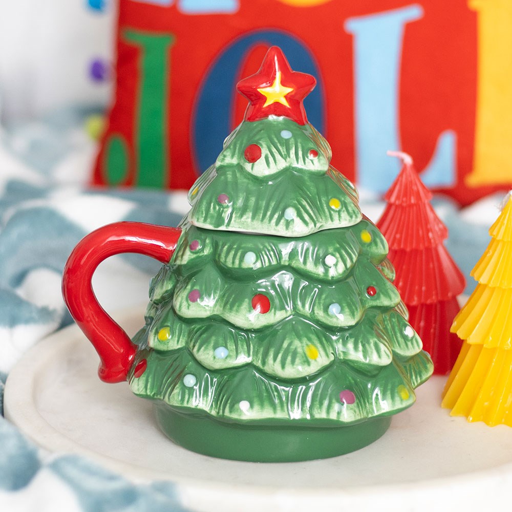 christmas tree shaped ceramic mug displayed in a festive christmas setting