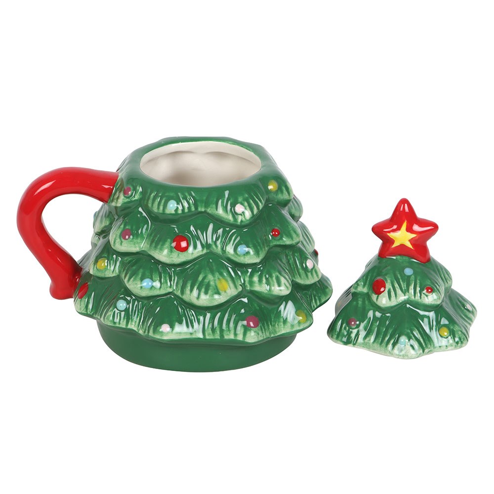 christmas tree shaped mug with matching ceramic lid placed beside it