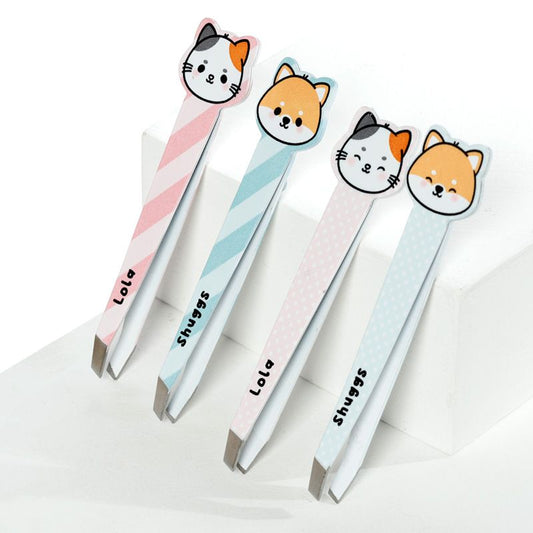 a set of four Adoramal Pets tweezers with cat face designs on the handles, in pink and blue colors with striped patterns