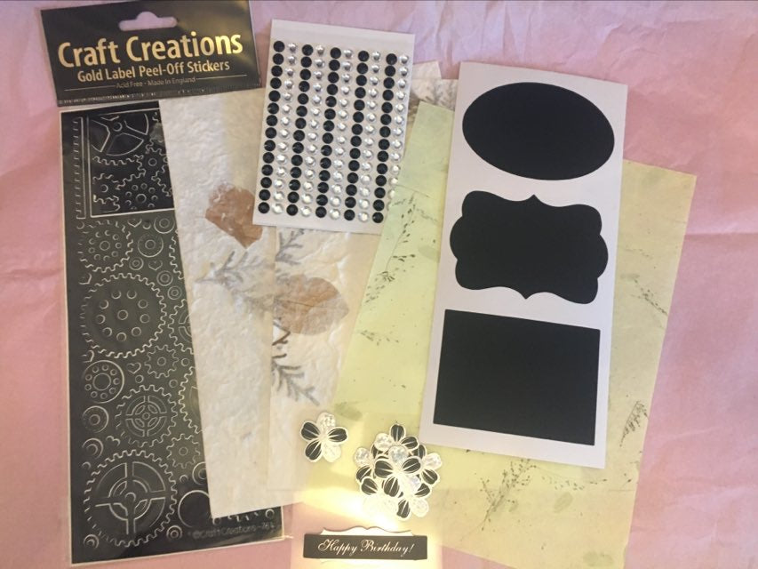 steampunk themed craft set with handmade paper sheets stickers gems and banner