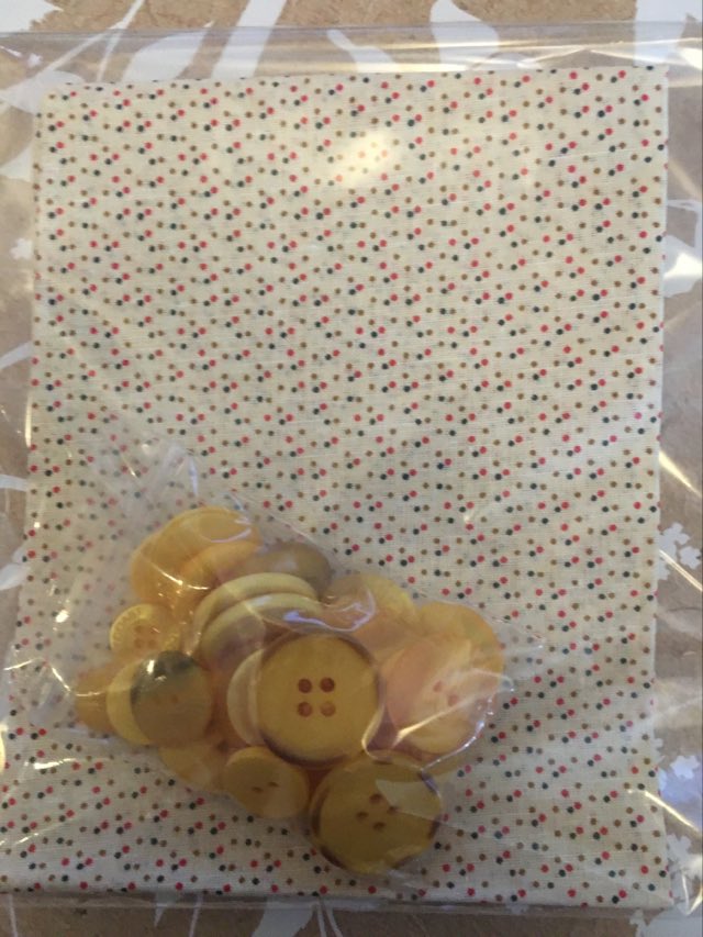 sunny fat quarter with buttons displaying cream fabric with spotty dot pattern and unique button mix