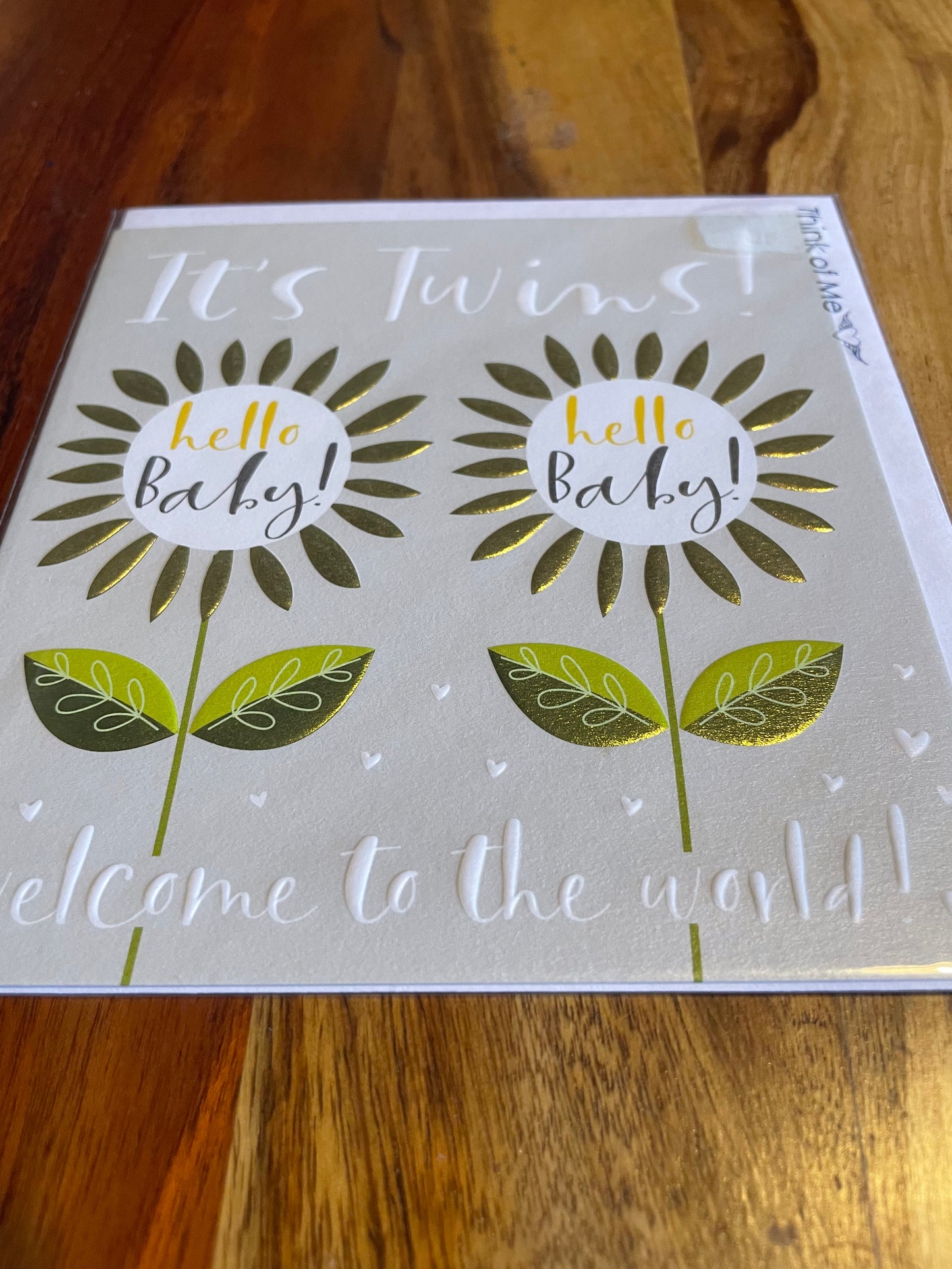 twins new baby flower card with sketched green flowers for a calming congratulatory message