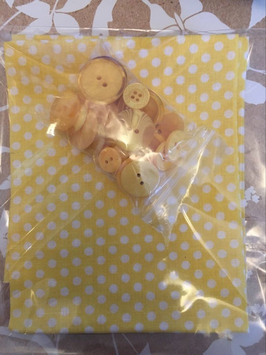 sunny fat quarter with buttons featuring yellow fabric with white dots and coordinating button assortment